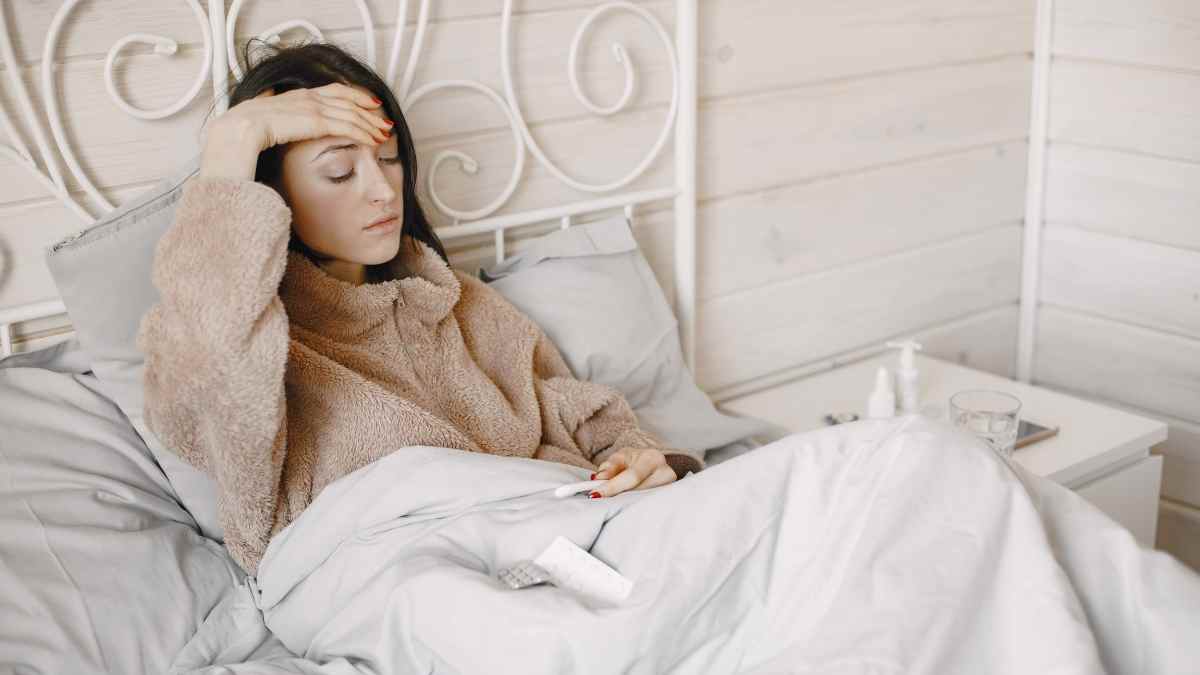 lady in bed with cold symptoms essential oil for colds